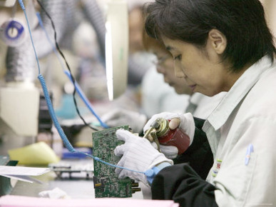 Woman Assembling Computer Boards, Taipei, Taiwan
