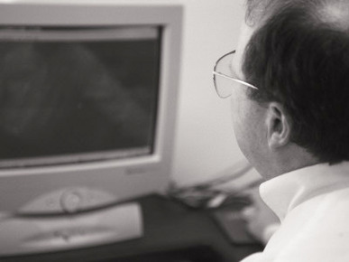 An Accountant Stares at a Computer Screen