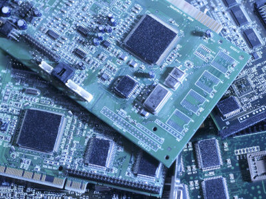 Computer Boards and Chips Lie in a Pile