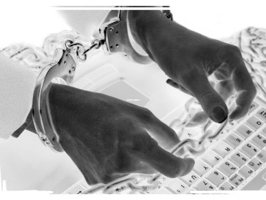Negative Image of Person Chained to Computer