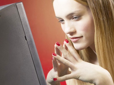Thoughtful Young Woman Using Black Computer