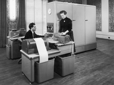 Man and a Women Working Together with a Pegasus Computer