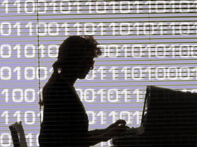 Silhouette of Woman Working on Computer