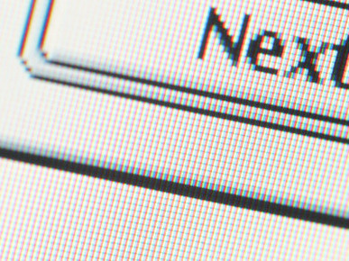 Close-Up of a Pixelated Next Icon on a Computer Screen