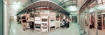 Three Technicians Working in a Computer Room