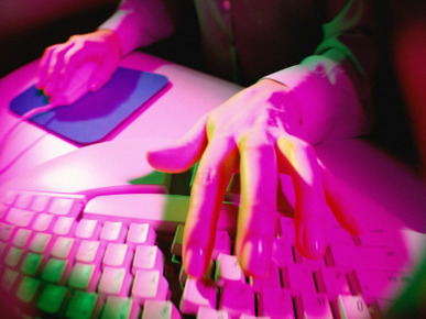 Woman Using Computer Keyboard and Mouse, Close-Up